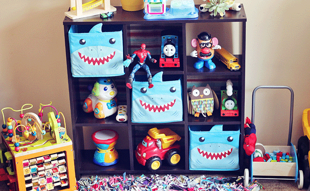 cube bookcase used as toy storage with bins